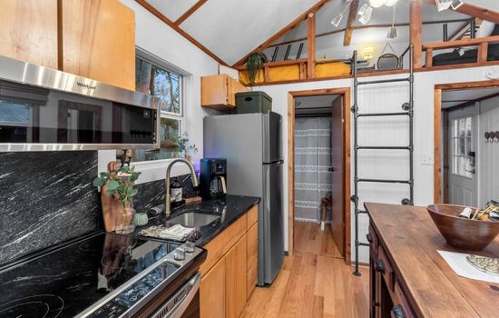 Lakefront Tiny Emerald w/kayaks & canoes