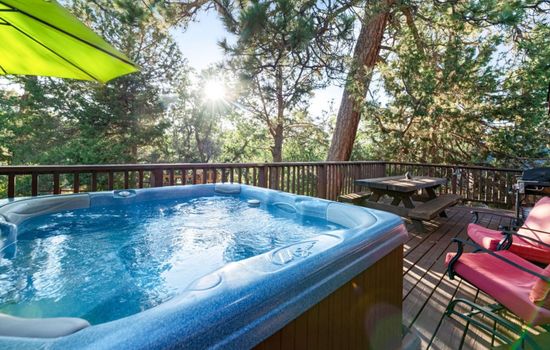 Indulge in luxury as you soak the hot tub amidst nature's beauty. Your tranquil escape awaits.