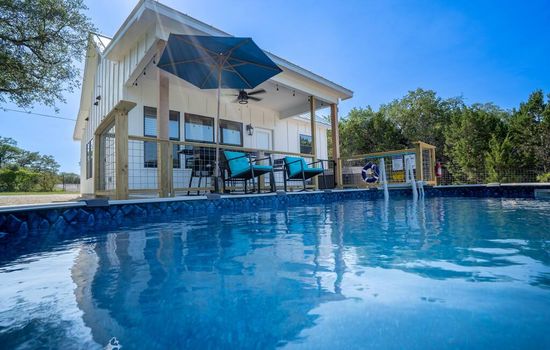 View from the pool looking at the back of home