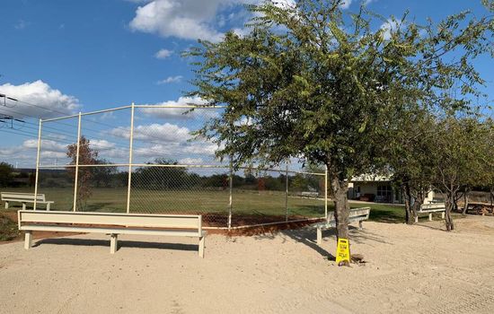 Lake Godstone Baseball backstop and seating