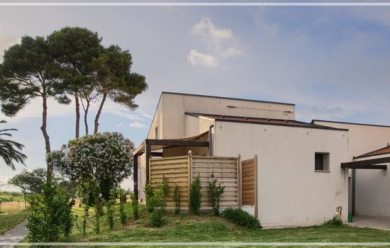 a patio in front of orange apartment, where you can have your breakfast or lunch. mistral wind