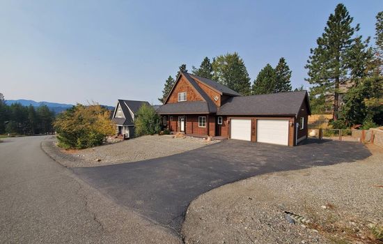 A home within the mountains.  Mountain views surround.