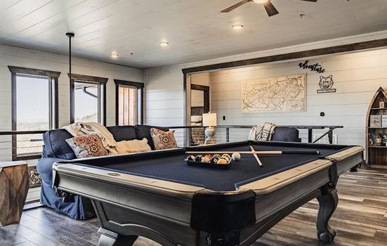 Open space upstairs with pool table
