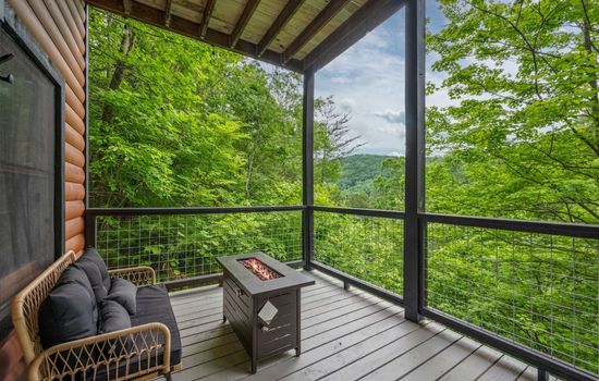 Enjoy the outdoor gas fire pit while looking at scenic views