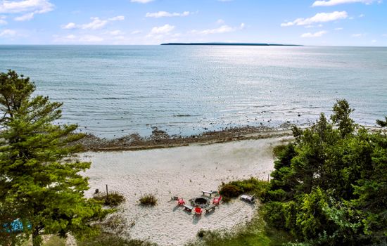 Aerial view of the property, with Mackinac Island in the distance