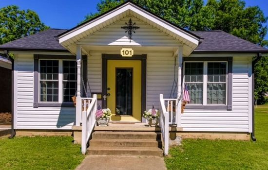 Welcome to old southern charm in the heart of Brighton, TN — this cute bungalow sits right on the historic town square.