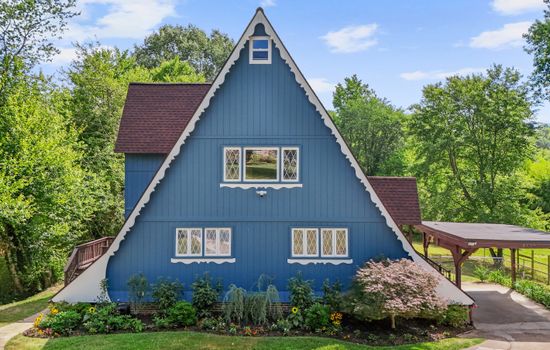 Escape to the Riverpoint, this unique house embodies the charm of a Swiss chalet A-Frame, complemented by a picturesque boathouse on the serene Canal of the Port Tobacco River.