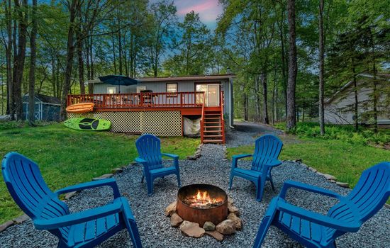 Inviting outdoor area with firepit and seating—perfect for s’mores and stories