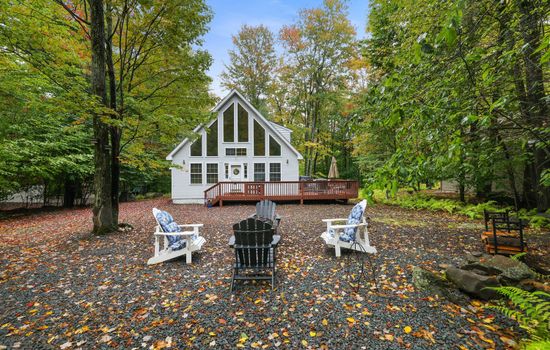 Pocono rentals - view in fall, large deck with table and seating, BBQ