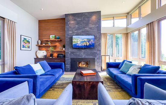 Cozy up on our plush couches for a movie night with our large TV