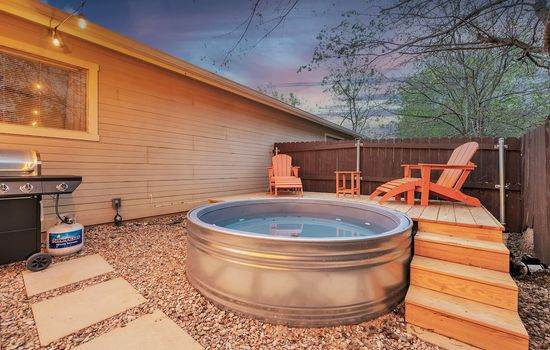 Rustic charm meets cool respite—a tiny cowboy pool and deck, a haven for laid-back moments under the big sky