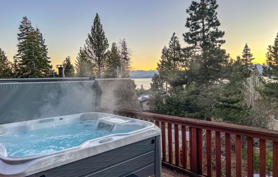 Soak up the sun from the back deck! Enjoy the private hot tub, patio table and BBQ grill. Plus there is a ping pong table underneath the deck.