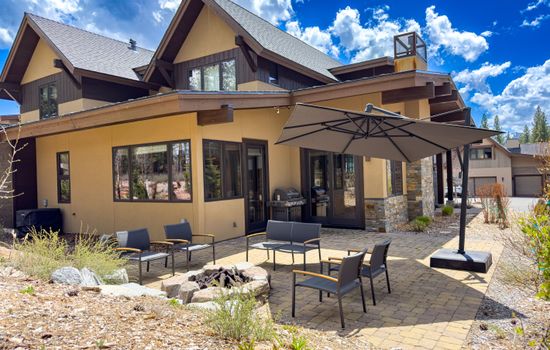 Breathe in the crisp mountain air as you relax on the spacious patio, complete with a natural gas BBQ for easy outdoor cooking, a large umbrella for shade, and a cozy gas firepit—perfect for u