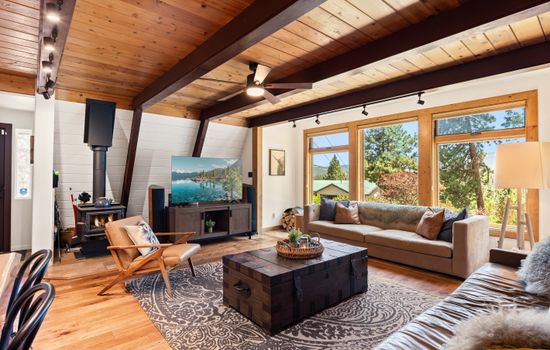 Cozy up in the heart of the home, floor-to-ceiling windows, 65" Smart TV and a wood-burning fireplace set the mood for your mountain escape. Whether it’s morning coffee or après-ski wine, this is the place to be.