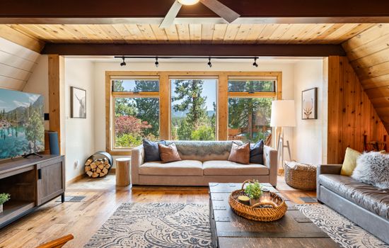 Cozy up in the heart of the home, floor-to-ceiling windows, 65" Smart TV and a wood-burning fireplace set the mood for your mountain escape. Whether it’s morning coffee or après-ski wine, this is the place to be.