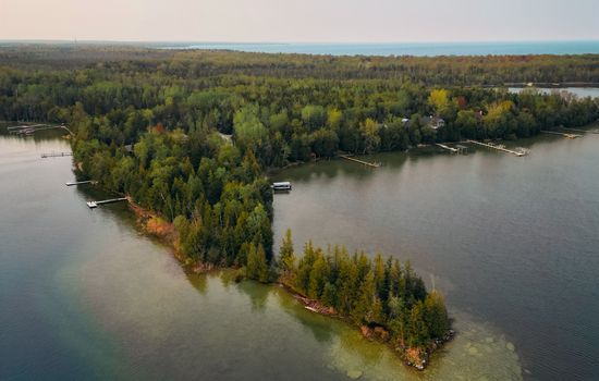 This private peninsula is all yours! East and west facing docks mean sunrises and sunset views from the cabin.