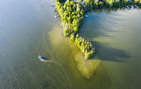 Located on a private peninsula, means 1200 feet of lake frontage and 360 degree views of the water at all times.