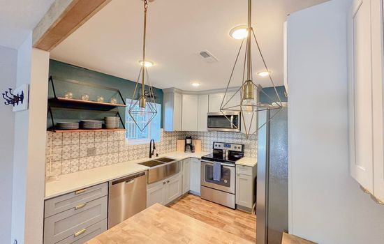 Feel at home with a fully equipped kitchen in this modern condo! Prepare your favorite meals with ease and enjoy the convenience of everything you need at your fingertips for a perfect stay.