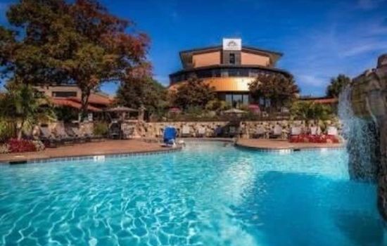A refreshing pool area surrounded by natural beauty, perfect for relaxation.