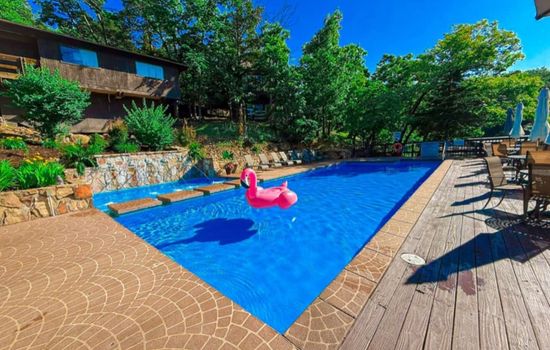 Soak up the sun and lake views! Guests at Treetop Villas enjoy access to two beautiful lakefront pools — the perfect spot to relax, swim, and float the day away.