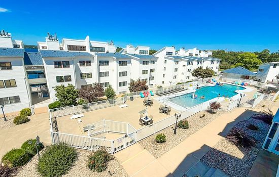 Soak in the views—relax with stunning sights of the lake and pool, all from the comfort of your condo.