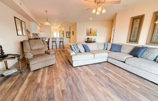 Stretch out and unwind in this bright, open-concept living space with plush seating and modern lake-home style.