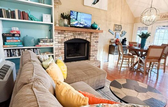 Enjoy a welcoming lounge with plush seating, playful décor, and seamless flow into the dining area. A guest favorite for movie nights, game time, and relaxing vacation vibes.