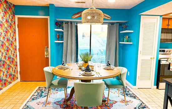 Relax in this dining room that is perfect for island style meals and cocktails.