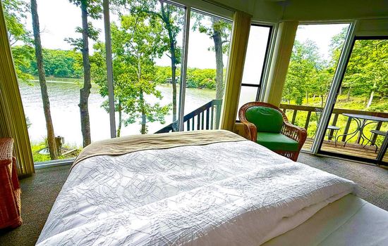 Wake up to breathtaking lake views from the comfortable master bedroom, designed to bring the beauty of the outdoors inside