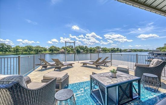 Upper dock with lounge chairs and seating area