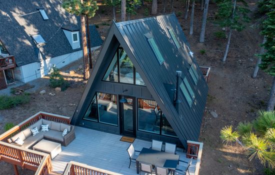 An iconic modern A-Frame with a commanding view of the Lake.