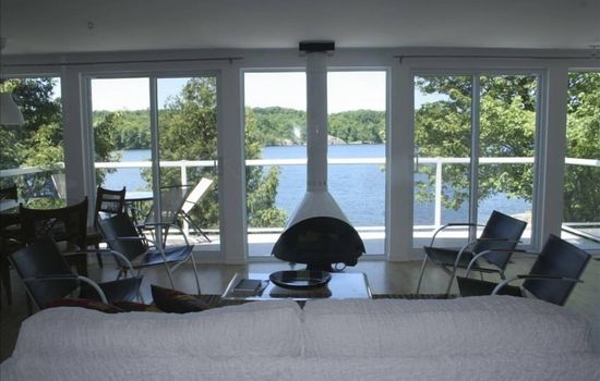 living room of upstairs unit- modern Malm gas fireplace and 25 feet of glass 
