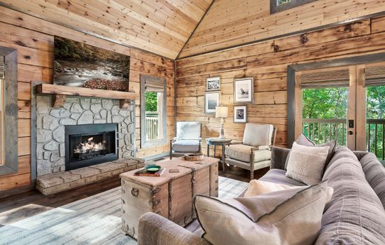 Relax by the stone fireplace in this private Smoky Mountain area cabin