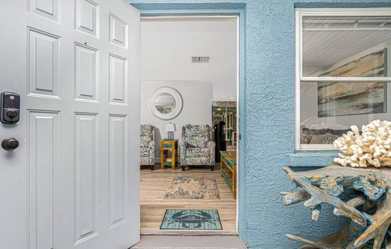 Head into the front lanai to enter the front door 