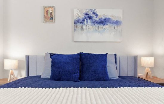 Bedroom 3 features a comfortable king-sized bed, and ample space to relax and unwind. 