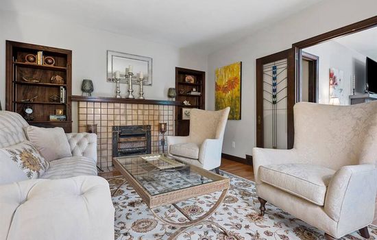 Formal living room 
Stainglass trifold doors are original craftsman details to the house