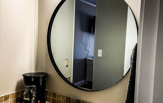Bathroom mirror and coffee maker