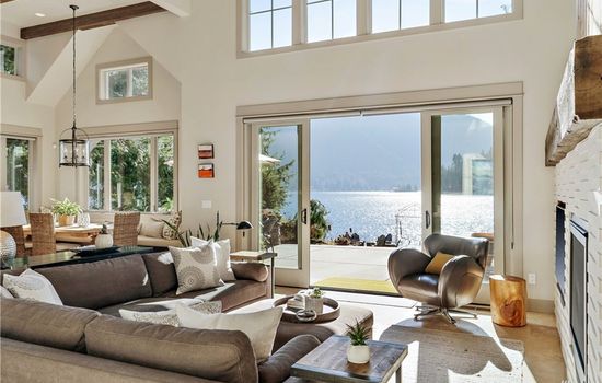 Bright living area with sliders that open to stunning lake views.