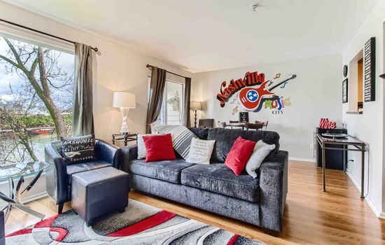 Spacious living room with queen sleeper sofa.