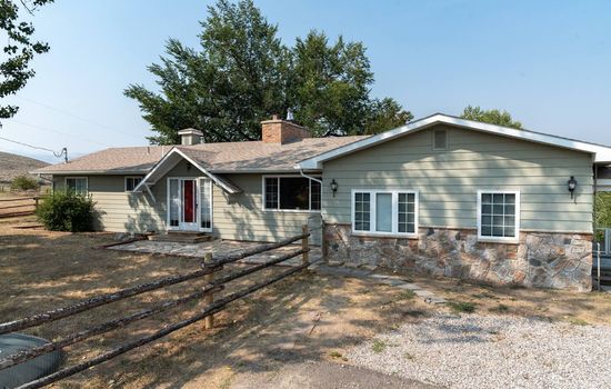 Wind River Place with room for parking for 3 cars on the driveway on the left.  