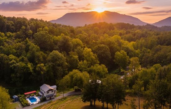 Welcome to Maple Valley Farm: A wide shot of the iconic farmhouse nestled in the heart of the valley.