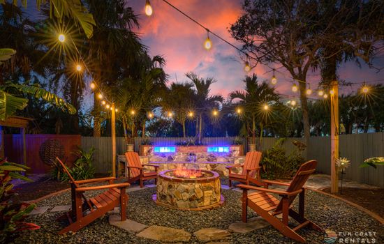 Private and inviting string lit zen Backyard with wood fire pit!