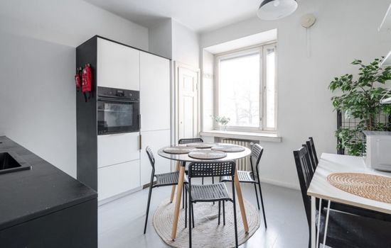 Apartment kitchen that includes oven, microwave, stove, cooker hood, washing machine and a dishwasher for instance