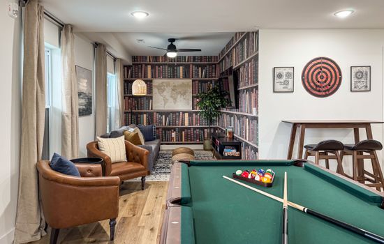 Lower level game room with pool table, foosball, and board games