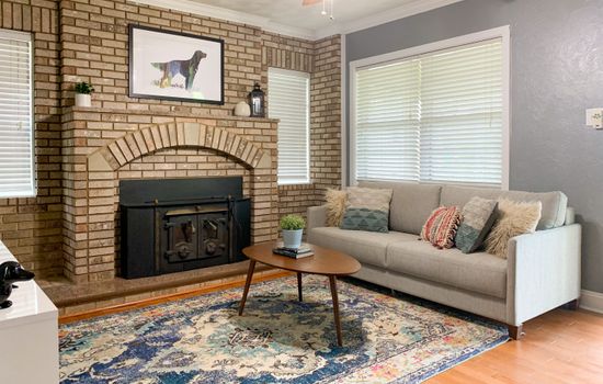 Bright and airy main level living area with smart TV and king sleeper sofa at Setter Haus.