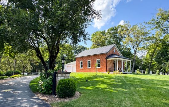 Gorgeous large yard for the doggies and front porch seating to enjoy the views and slow mornings at Pikes Peak Schoolhouse.