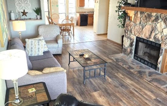 The Calm Cove open living room with fireplace – lakefront vacation rental in Osage Beach, Missouri