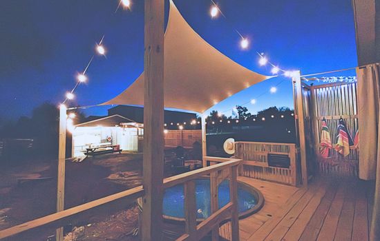 Private cowboy pool under the lights — soak, cool off, and unwind day or night