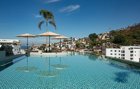 D'Vine is a stunning, state-of-the-art building just a 5-minute stroll from the beach, located in the vibrant heart of Puerto Vallarta's Romantic Zone, where modern luxury meets coastal charm.