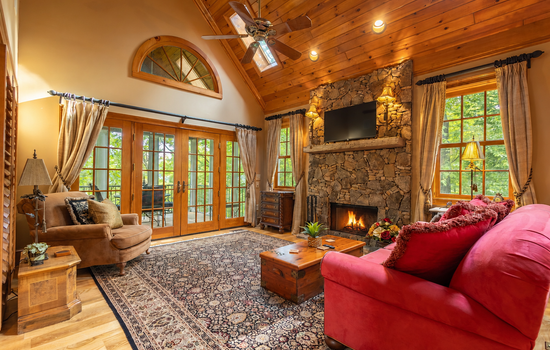 Gather around the cozy wood-burning fireplace beneath soaring vaulted ceilings and enjoy the peaceful mountain atmosphere at Cheoah Cottage.